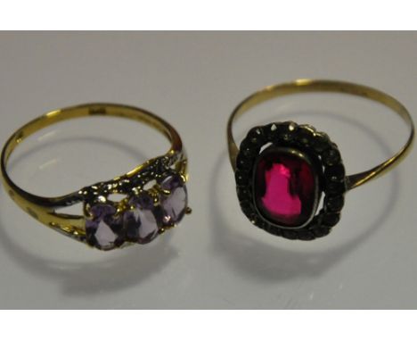 A 9ct gold white sapphire and red dress ring together with a 9ct gold amethyst and diamond ring