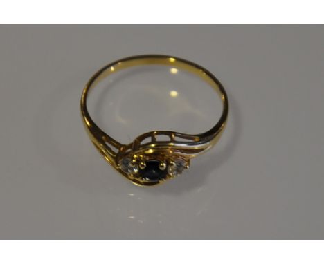 A 14 carat gold ring, set with diamonds and sapphire