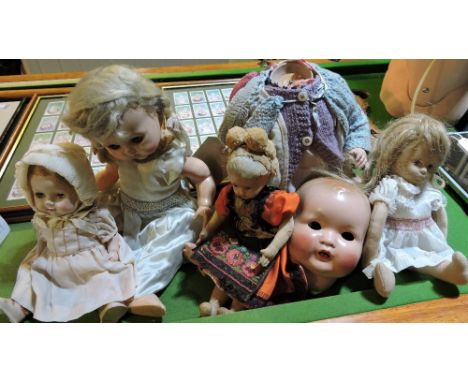 A collection of five assorted vintage dolls