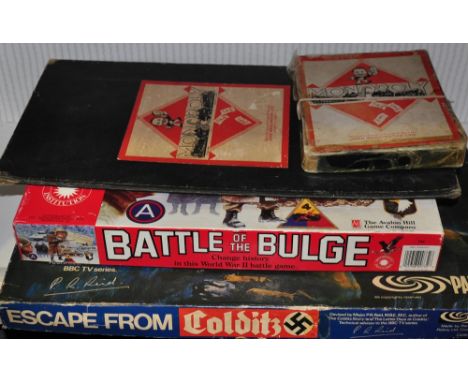 Parker Toys, a 1970's Colditz board game together with an early Monopoly set and a Battle of the Bulge board game