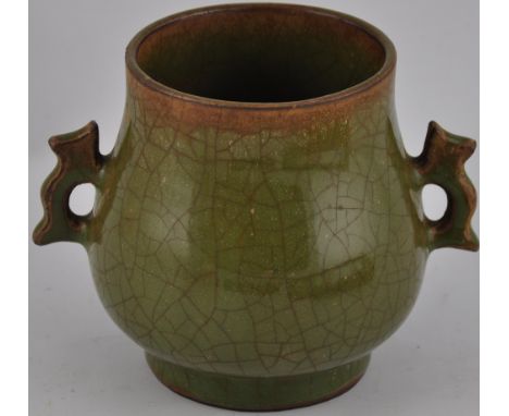 A Chinese green crackle glaze incense burner with pierced scroll handles, H11cm