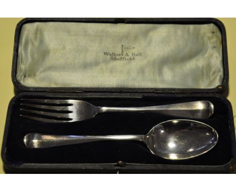 A cased silver fork and spoon, hallmarked Sheffield 1918