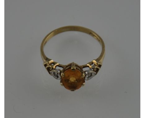 A vintage 9ct gold, oval citrine and diamond ring