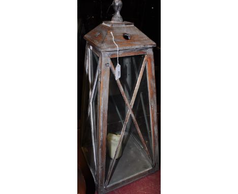 A vintage style distressed wood lantern of tapered square form, H. 84cm