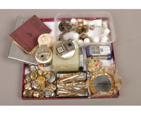 A tray of collectables military style button thimbles, cigarette lighters and tie clips etc.