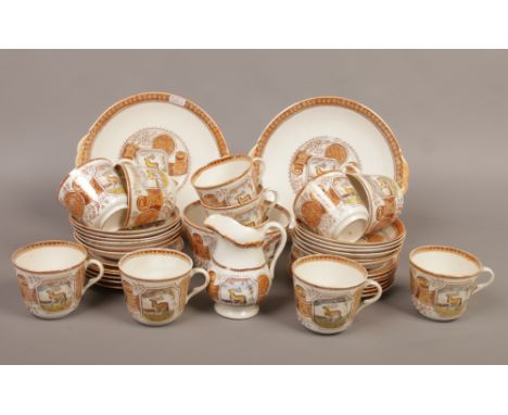 A 19th century Aesthetic movement 12 place porcelain tea service c.1870-90 printed and enameled with stags and landscape scen