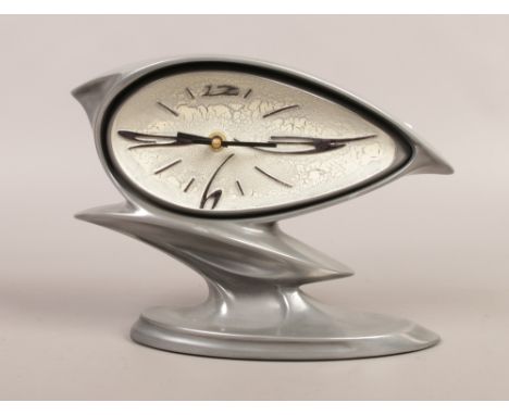 A Salvador Dali style mantle clock by Baroque design.