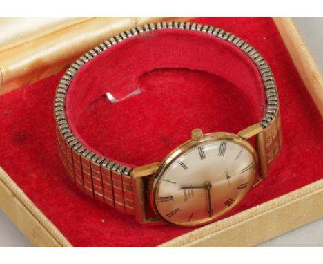 A vintage Summit gents gold plated manual bracelet watch in original makers box.