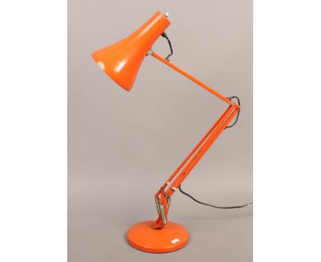 A painted anglepoise lamp with cast iron weighted base.