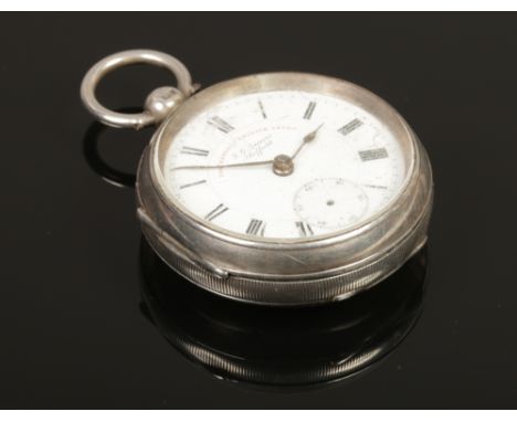 A silver pocket watch with Roman numeral markers, assayed Chester 1904 by John George Graves.