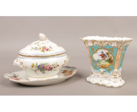 A Paris porcelain tureen in the serves style along with a porcelain hand painted vase with figures and gilt decoration.Condit