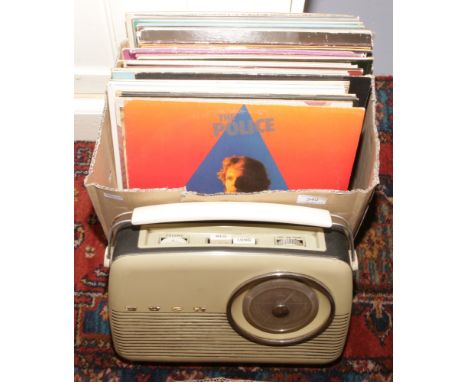 A Bush TR 82C transistor radio and collection of L.P records to include The Police, The Shadows etc.