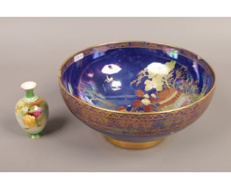 A Carltonware lustre bowl with blue ground and decorated with an oriental landscape,along with miniature Royal Worcester bott