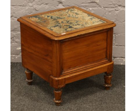 A Victorian mahogany commode raised on turned feet with pot liner.