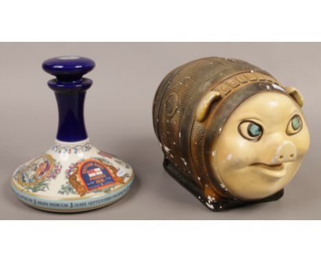 A novelty Guinness money bank, along with a Wade ceramic Pussers rum decanter (empty).