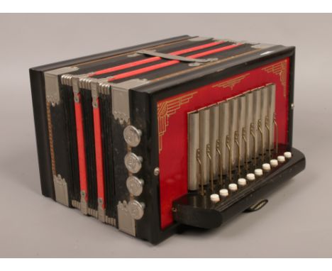 A small accordion squeeze box / concertina.