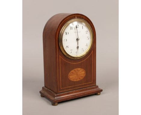 An early 20th century mahogany cased dome top mantle clock with boxwood strung inlay and white enamel dial, marked Thurlow Ch