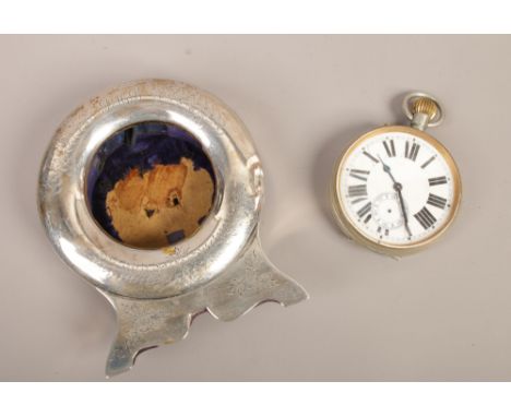 A silver mounted pocket watch holder, along with a nickel cased pocket watch with Roman numeral markers, assayed Birmingham 1