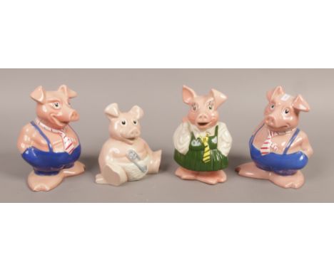 Four Wade ceramic Natwest piggy banks.