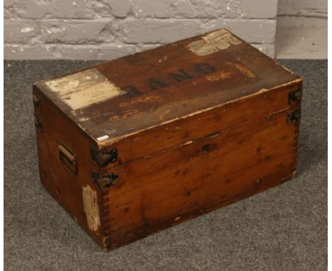 An early 20th century twin handle pine travel trunk, stencilled R.A.N.G.