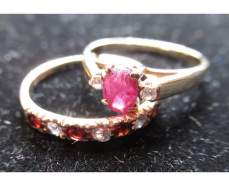 15ct yellow gold and ruby ring with oval cut ruby flanked by two round cut white stones, stamped 585, size M, 2.2g and a garn