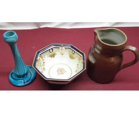 Burmantofts Faience art nouveau blue glaze candlestick, C19th salt glazed stoneware jug and a Noritake blue and gilt bowl (3)