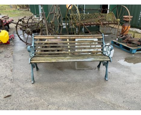 Garden bench with wooden slats and scroll design metal ends 