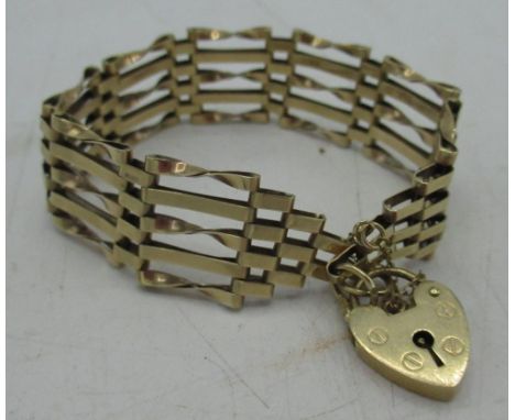 Hallmarked 9ct yellow gold five bar gate bracelet with heart padlock clasp and safety chain by (makers mark rubbed), London, 