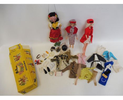 A boxed Pelham Puppet - SS Gypsy plus two plastic dolls circa 1960s, with many items of clothing and accessories.