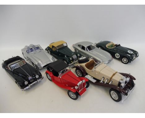 A selection of Burago die-cast models including the Jaguar E-type, Morgan, MG etc.