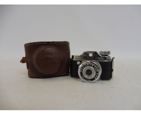 A miniature leather cased Japanese 1960s camera.