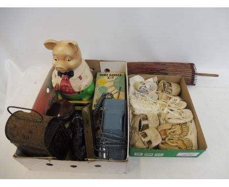 A box of mixed collectables including a Mr Pig ceramic money box by Ellgreave, a B.R. lamp etc, also a selection of dolls clo