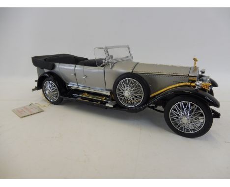 A Franklin Mint scale model of a 1925 Rolls-Royce Silver Ghost.