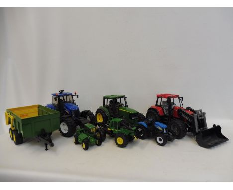 A selection of large scale Britains and Bruda plastic farm machinery.