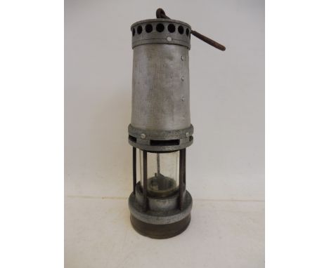 An aluminium miners lamp.