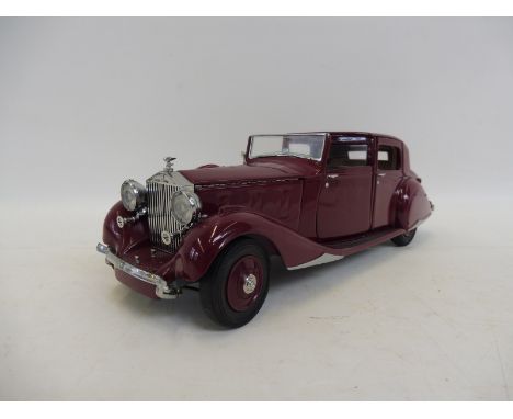 A Franklin Mint scale model of a 1938 Rolls-Royce Phantom III.