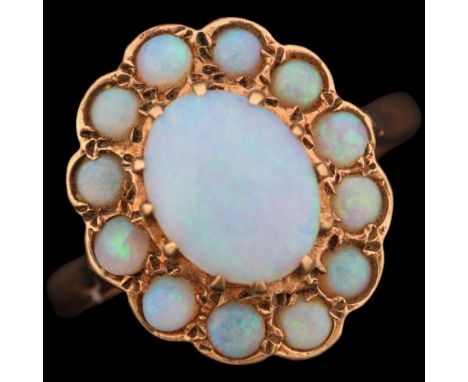 A 9ct gold opal flowerhead cluster ring, maker HBJ, London 1982, set with oval and round cabochon opals, setting height 16.3m