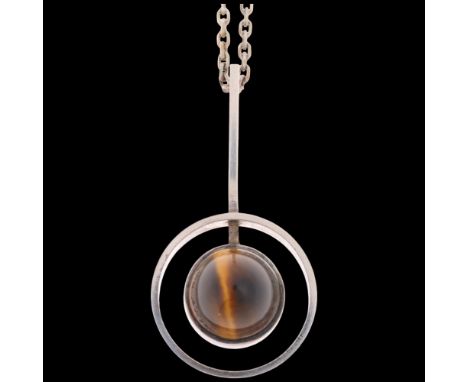 A Danish modernist sterling silver tigers eye openwork pendant necklace, in the manner of Niels Erik From, on sterling cable 