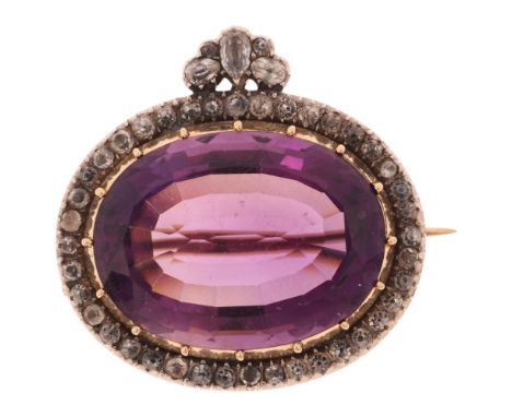 An Antique Georgian amethyst and black dot paste cluster brooch, circa 1800, cut-down collet set with oval mixed-cut amethyst