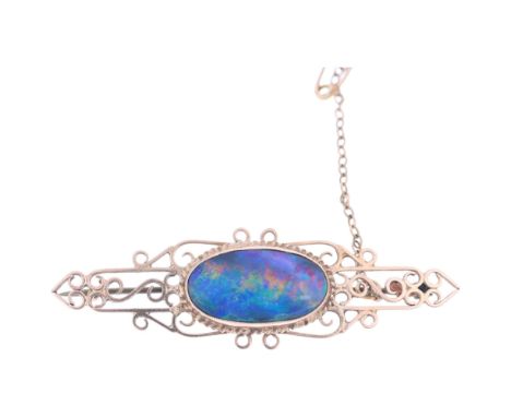 A Vintage 9ct gold black opal doublet openwork brooch, unmarked mount tests as 9ct, 52.5mm, 4gOpal has a very good play of co