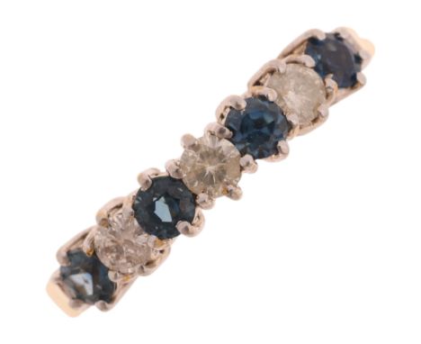 An 18ct gold seven stone sapphire and diamond half hoop ring, set with round-cut sapphires and modern round brilliant-cut dia