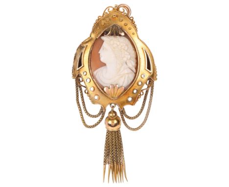 A Victorian 18ct gold Etruscan Revival shell cameo brooch, circa 1880, set with relief carved marquise shell panel depicting 