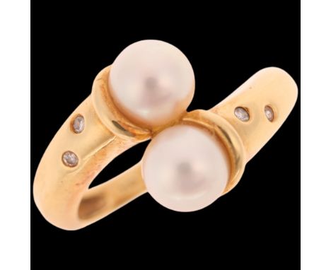 GARRARD & CO - an 18ct gold cultured pearl and diamond crossover ring, maker G & Co, import London 1992, total diamond conten
