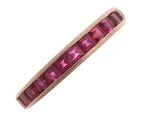 An Art Deco 18ct white gold ruby half eternity band ring, channel set with calibre-cut rubies, band width 3.5mm, size M, 3.3g