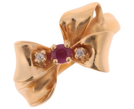 A 14ct gold three stone ruby and diamond ribbon bow dress ring, by Franklin Mint, setting height 11.4mm, size P, 4.4gNo damag