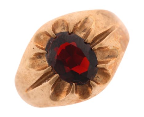A 9ct gold single stone garnet gypsy ring, maker FM, London 1966, set with oval mixed-cut garnet, setting height 13.6mm, size