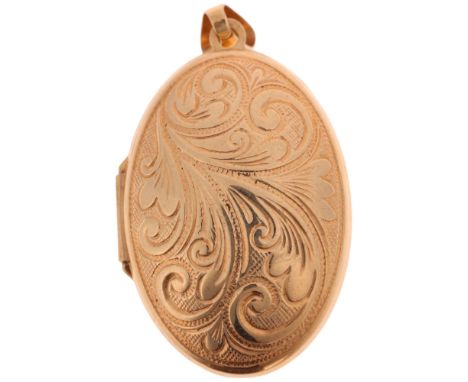 A 9ct gold bombe locket pendant, maker GA, no Birmingham date letter, oval form with foliate decoration, 40.9mm, 4.1g grossNo