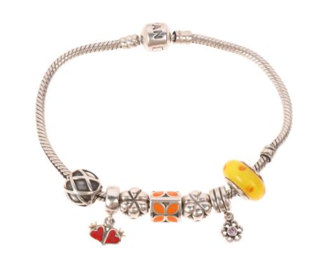 PANDORA - a sterling silver snake link charm bracelet, with 7 silver charms, 19.5cm, 33.6gNo damage or repair, only light sur
