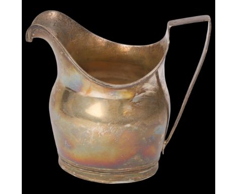 A George III silver helmet cream jug, no maker, London 1802, 11cm, 4.1ozBody has several light dents, otherwise only light su