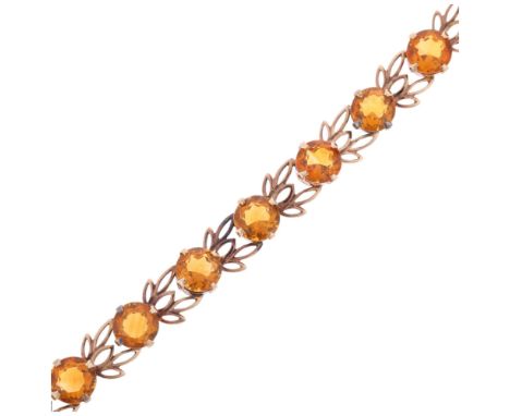 A Vintage 9ct rose gold citrine line bracelet, maker W&H, Birmingham 1959, pierced floral openwork decoration, band width 10m